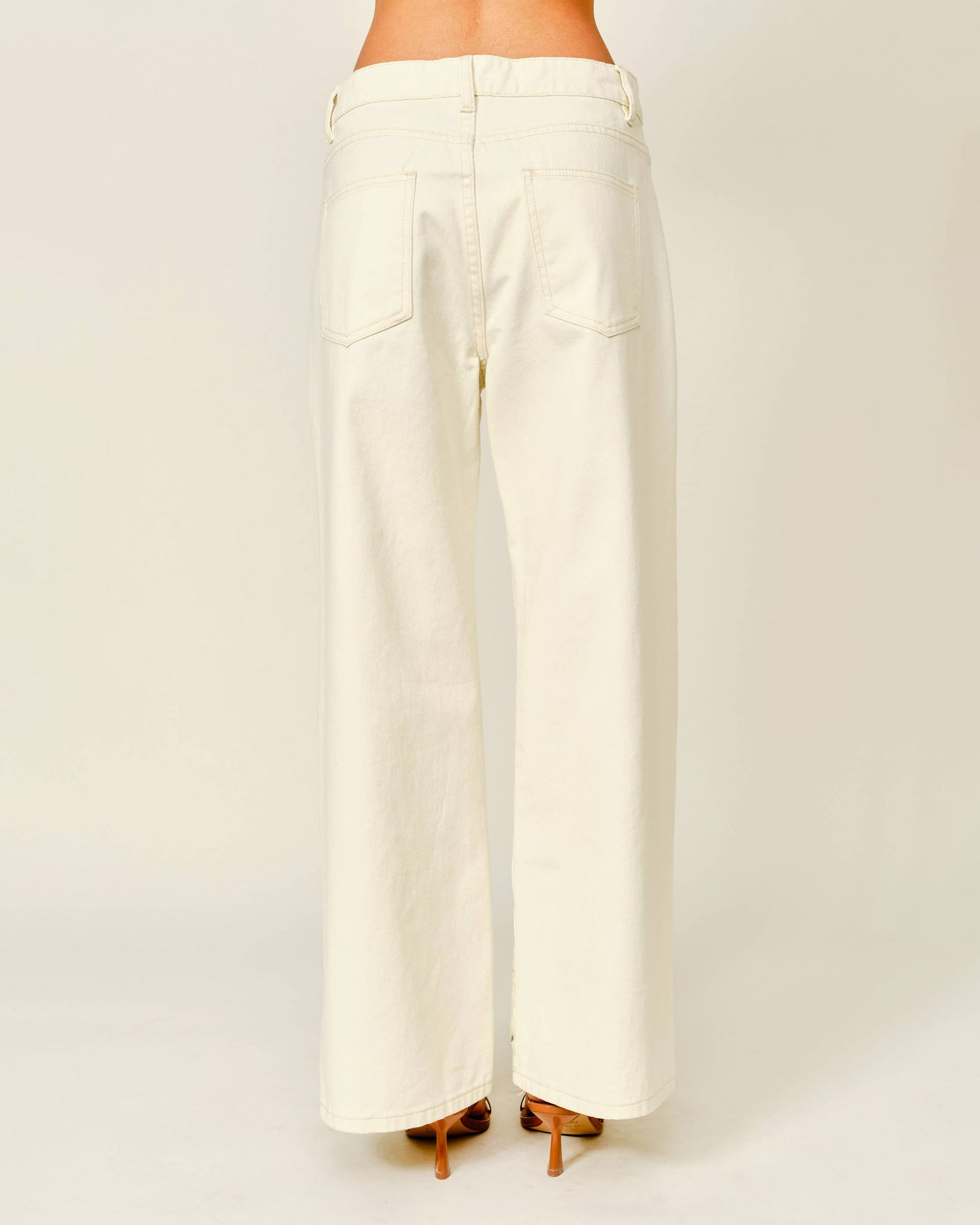 White wide-leg pants on a plain background