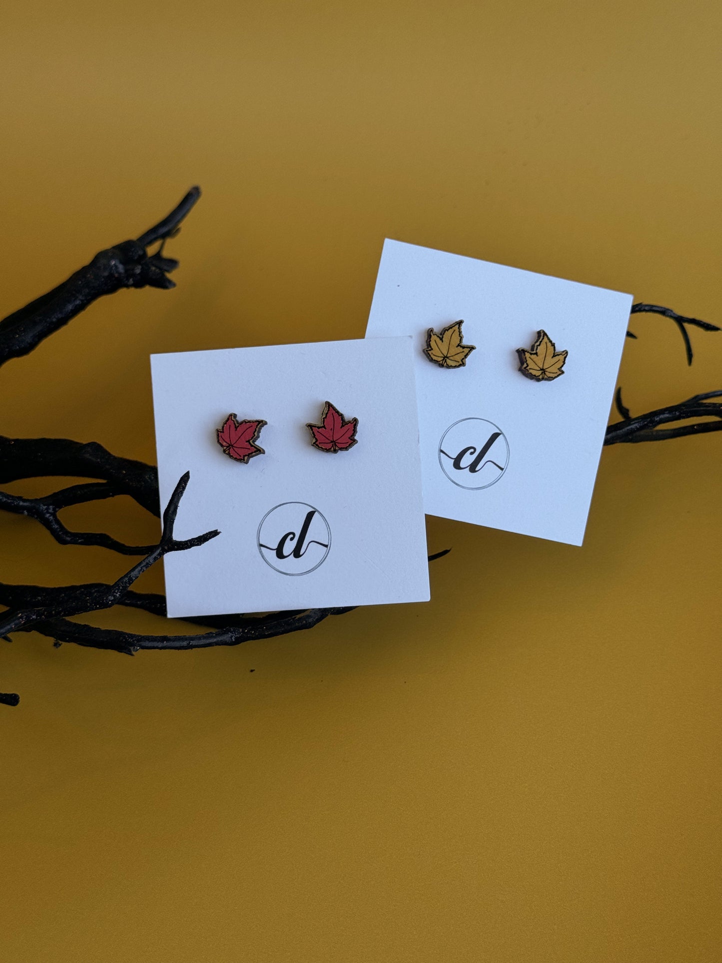 Hand-painted wooden Halloween earrings featuring spooky designs, perfect for fall fashion and Halloween celebrations. Lightweight, eco-friendly, and crafted for a festive touch.