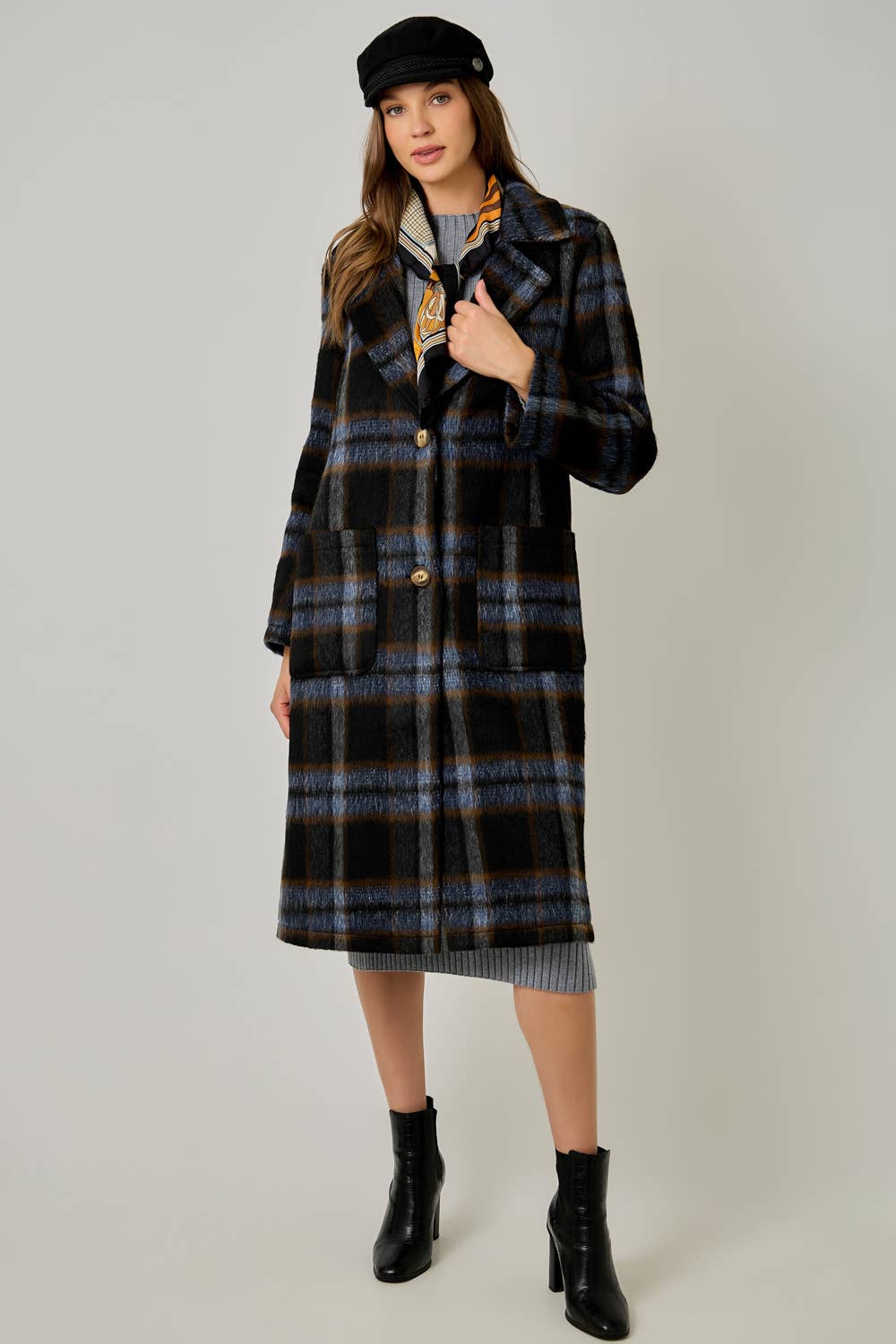 Women's brushed plaid midi coat with notched lapel, double-button closure, and side pockets.