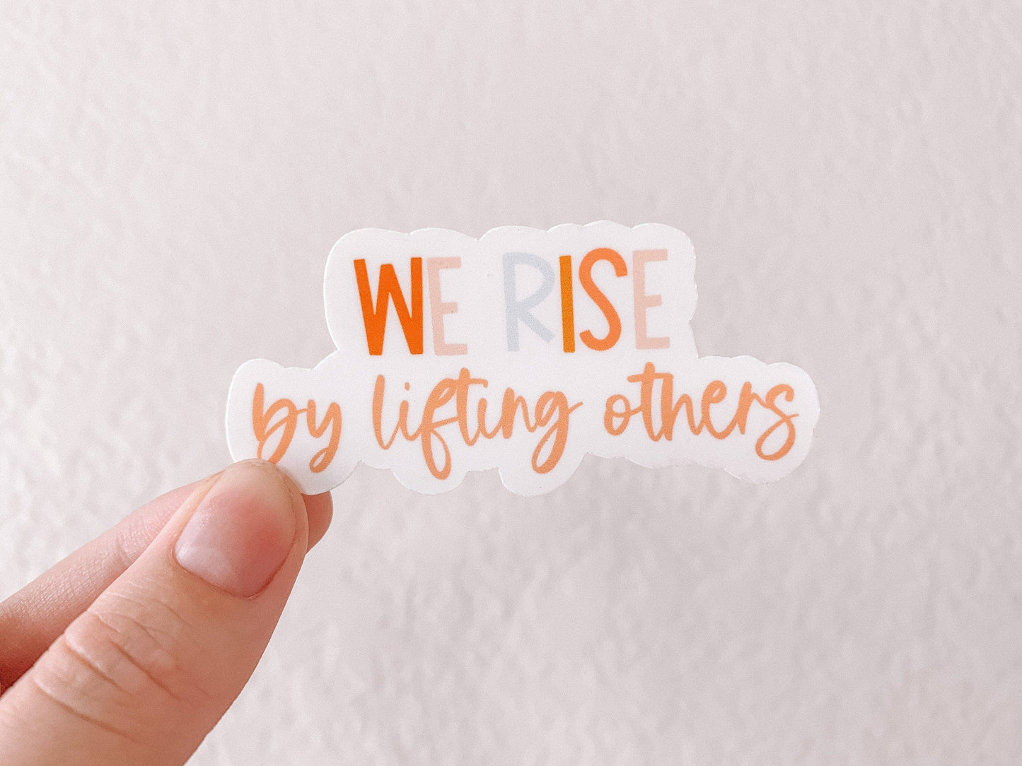 We Rise By Lifting Others Sticker