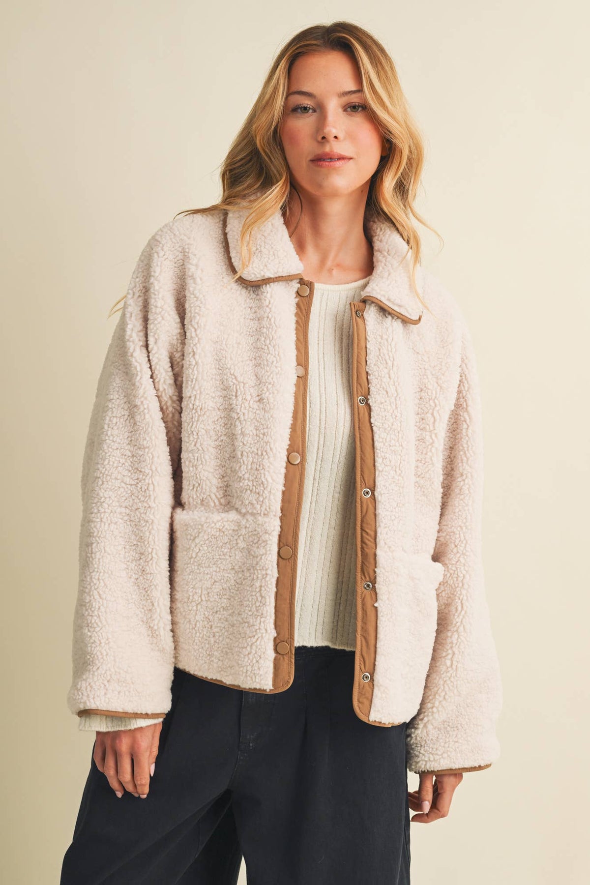 Women's reversible plush fleece jacket featuring a cozy textured fleece side and smooth woven reverse for versatile fall and winter layering.